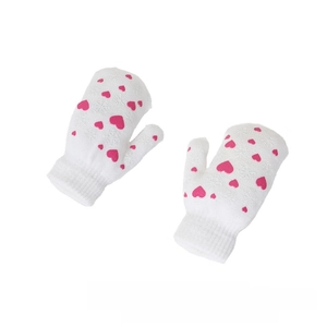 Close-up of white knitted mittens with pink heart patterns and winter snowflake textures