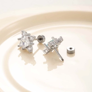 Titanium steel stud earrings featuring sparkling rhombic zircon and cross flower design
