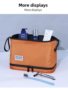 Detail of orange double-layer travel toiletry bag showing wet-dry separation storage