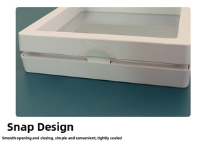 Detail view of the secure PUSH button closure on a transparent jewelry suspension box