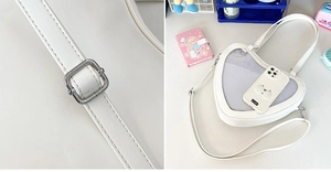 Detailed close-up of white heart-shaped Ita bag with clear mesh window and metal buckle