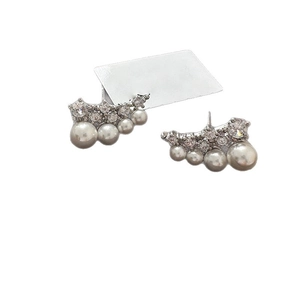 Elegant wave earrings with white pearls and sparkling zircons in silver setting