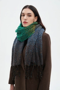 Detail view of multicolored woven texture and elegant fringe tassels on the winter shawl