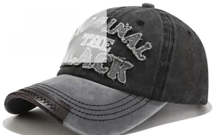 Close-up of vintage washed denim baseball cap with letter embroidery and leather brim detail