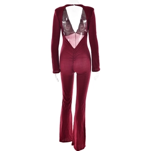 Rear view detail of deep V-neck open back burgundy long sleeve flare leg jumpsuit
