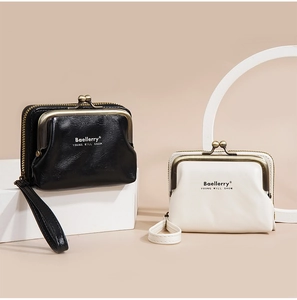 Detail view of lychee pattern PU leather coin purses with vintage metal frame and strap