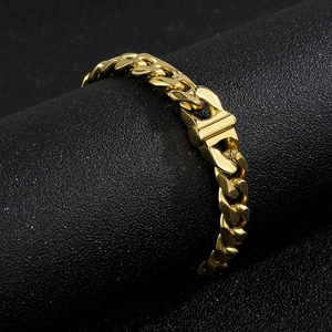 Macro shot of 10mm golden Cuban link chain with detailed fold-over clasp on black display