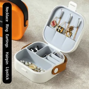 Portable white jewelry box organizer with leather handle and velvet lining for necklaces