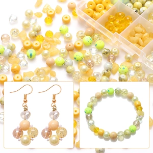 DIY bead jewelry kit with yellow and green glass beads and crystal stones in storage box