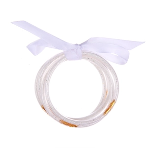 Glitter filled multi-layer silicone bangles set tied with an elegant white ribbon bow
