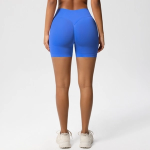 Detailed back view of high waist royal blue yoga shorts with V-shaped peach lift seam