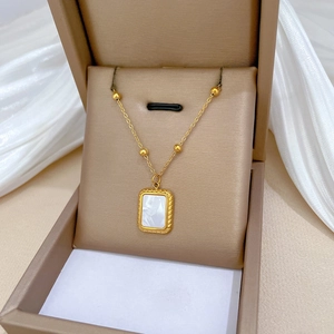 Minimalist gold plated stainless steel necklace with shell pendant in a gift box