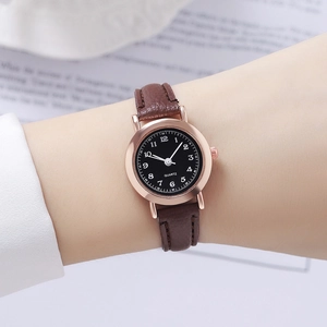 Vintage style women's quartz watch with brown leather strap and black round dial