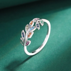 S925 sterling silver olive branch ring with colorful zircon leaves on dark background