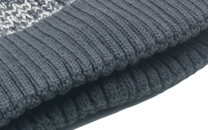 Close-up of ribbed knit texture and geometric pattern on a warm winter beanie hat