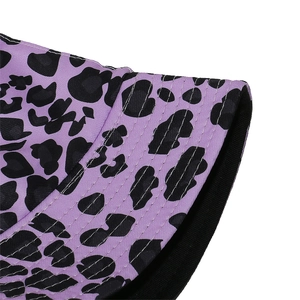 Detailed close-up of purple leopard print bucket hat with white reinforced stitching lines