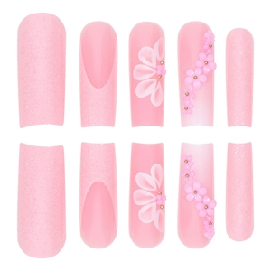 Long pink floral press-on nails with 3D embossed flowers and sparkling glitter accents