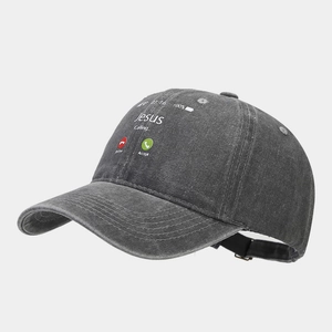 Detail view of washed denim baseball cap with Jesus Calling screen print and metal buckle