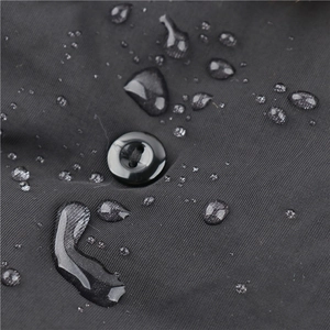 Waterproof trapper hat with high-density fabric showing water droplets on black material