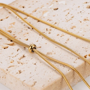 Golden adjustable snake chain necklace with pearl slide bead on minimalist stone
