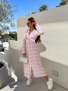 Detail of white floral maxi dress with V-neck button design and lightweight chiffon fabric