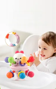 Macro detail of sensory baby toy with textured soft balls and strong suction cup base