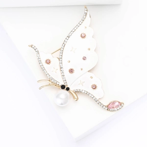 Elegant gold butterfly brooch with white enamel, pink crystals and a large white pearl