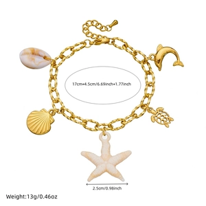 Golden stainless steel chain bracelet featuring sea star, dolphin, and turtle charms