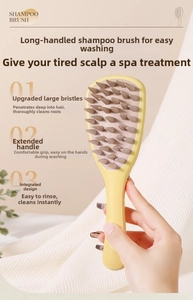 Detail showing the long ergonomic handle and thick silicone bristles of the scalp massager brush