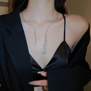 Close-up of elegant silver tassel choker necklace with sparkling zircon fringe detail