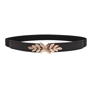 Close-up of a black elastic waist belt with an elegant gold leaf-shaped metal buckle