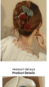 Detailed close-up of handmade cherry hair claw clip and elegant pearl necklace on a model