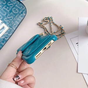Quilted dark teal crossbody case for iPhone with a woven gold chain strap and precise cutouts