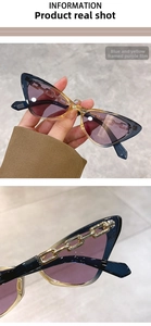 Detailed view of cat eye sunglasses with blue-yellow frame and gold chain decor