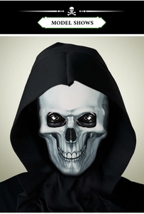 Detailed view of Halloween glowing skeleton mask with realistic teeth and black hood cover