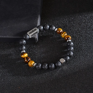 Customized lava stone and tiger eye beaded bracelet with an engraved stainless steel tag
