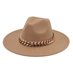 Detail of camel fedora hat featuring a chunky gold chain band on wide brim wool felt