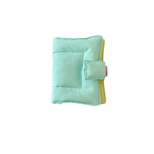 Mint green fabric binder notebook cover with quilted texture and snap button closure