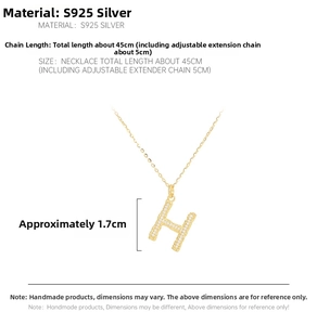 Detailed view of S925 silver golden H letter pendant with white zircon micro-inlay