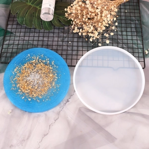 Round silicone mold for DIY resin coasters featuring blue gold foil and silver glitter