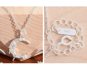 Macro detail of S925 sterling silver moon pendant with zircons and textured finish