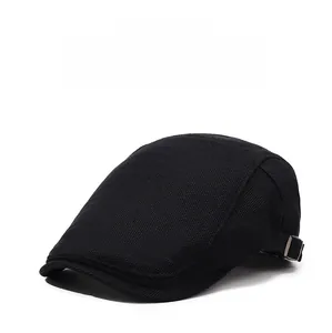 Detail of breathable mesh texture and adjustable metal buckle on a black flat cap