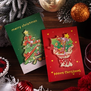 3D pop-up Christmas cards featuring paper-cut festive trees and floral bouquet designs