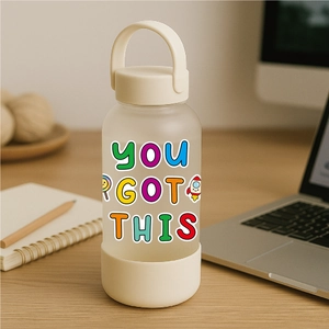 Close-up of matte water bottle with 'YOU GOT THIS' sticker in a desk office setting