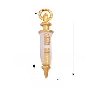 Macro detail of syringe pendant with gold finish and white enamel showing precise dimensions