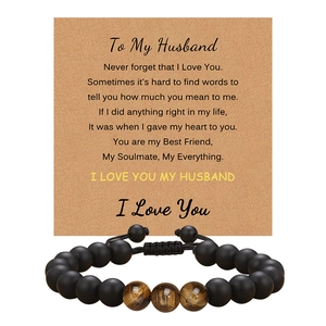 Handmade tiger eye beaded bracelet with sentimental gift card for husband on white background