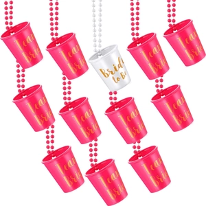 Set of 12 plastic shot glass necklaces for hen parties in pink and white with gold lettering
