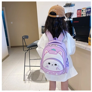 Detail view of purple cartoon cat backpack with wide straps and mesh side pocket