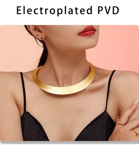 Detail showing the electroplated PVD gold finish on a wide punk style choker necklace