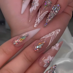 Extra long stiletto press-on nails with 3D white flowers and sparkling crystals